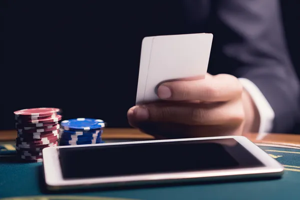 A young woman relaxing with her phone while dynamic casino elements float around her, illustrating the smooth mobile experience offered by the 786BED app.