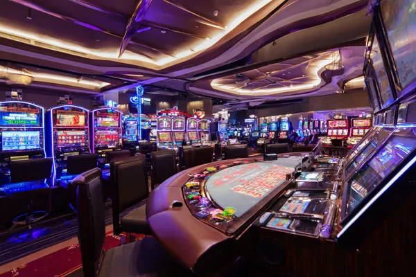 A glowing roulette wheel with cascading chips, symbolizing the engaging live and instant-win games available on 786BED.